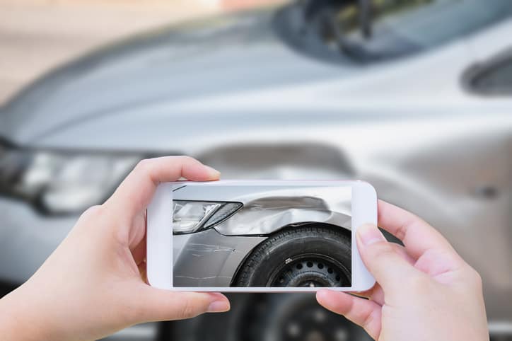 woman using mobile smartphone take photo car crash accident